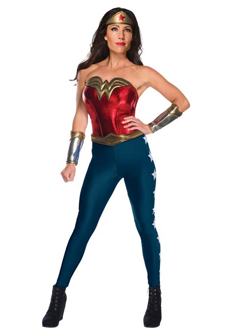 Adult wonder women costume - Buy the Wonder Woman Movie - Wonder Woman Adult Costume and truly become a superhero for a day! This officially licensed ensemble features a gold, red, and blue dress with attached shorts, a gold belt, silver gauntlets, and boot covers. Finish this look with boots or sneakers. Add a toy sword and a lasso of truth as accessories.